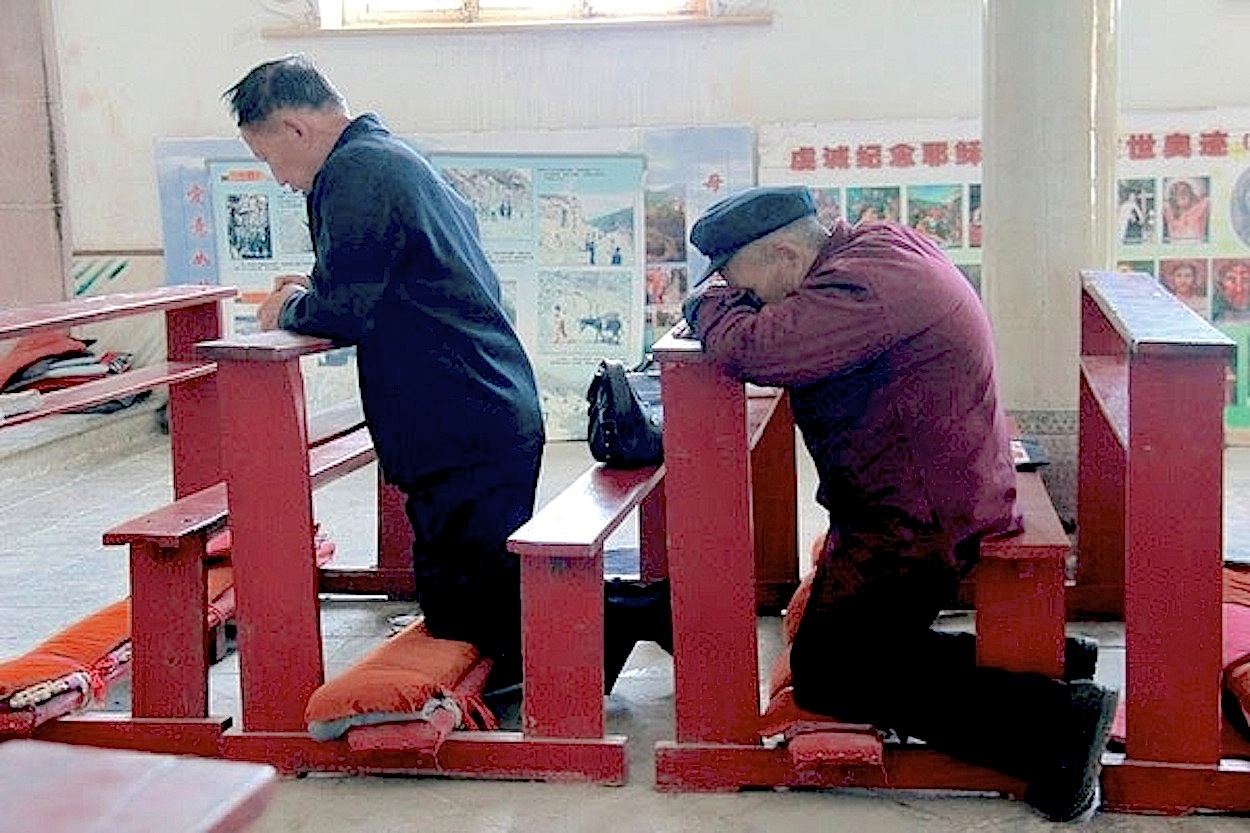 Catholics praying in China