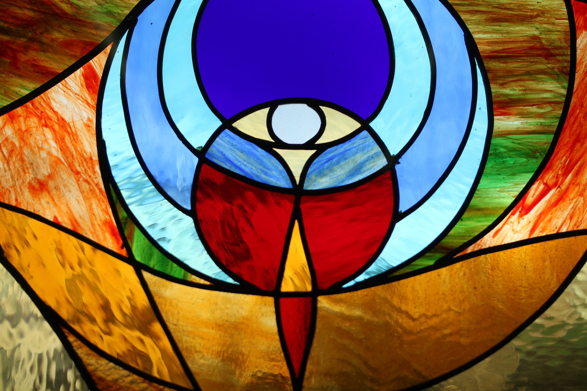 Modern stained glass window showing the Eucharist
